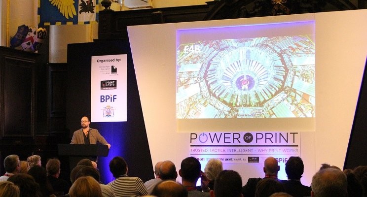 man giving a presentation at a conference - custom packaging boxes