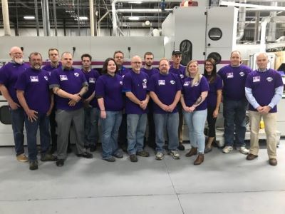 group photo of staff at priority envelope - print finishing