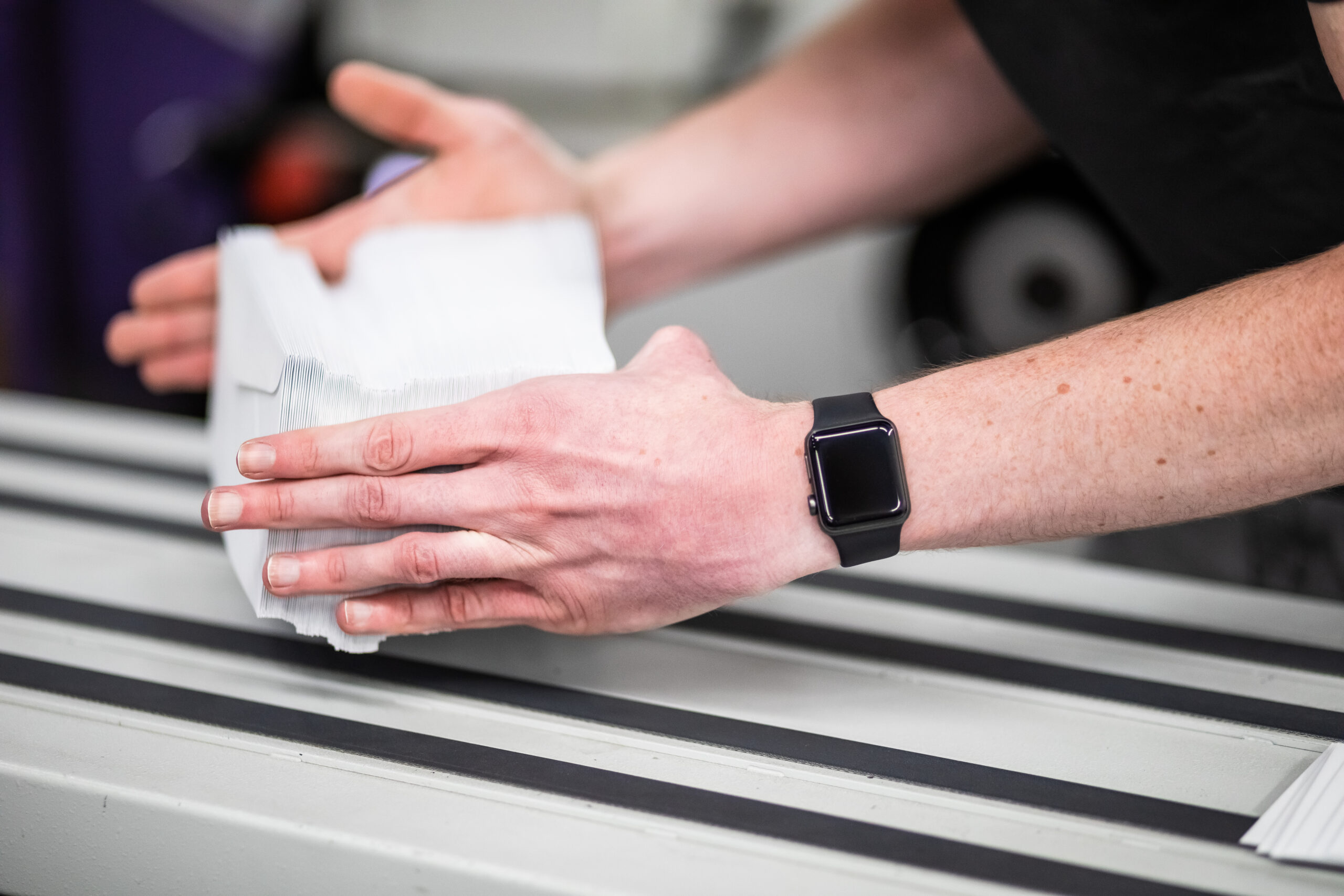 Person holding a stack of envelopes - invitation envelopes sizes